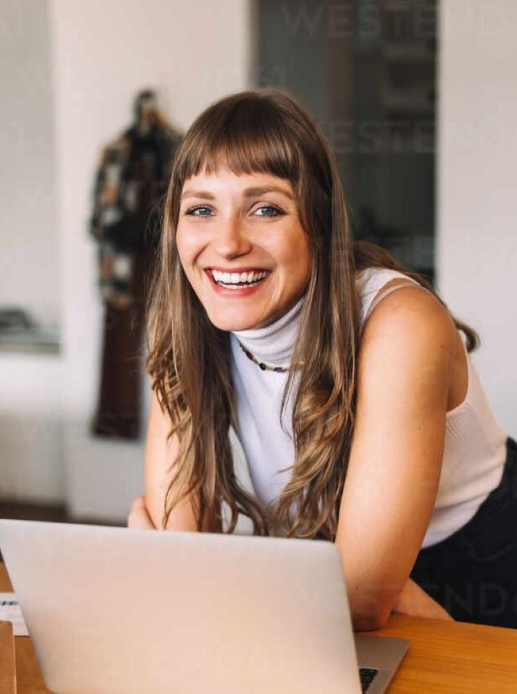 smiling woman business owner happy with her new web design